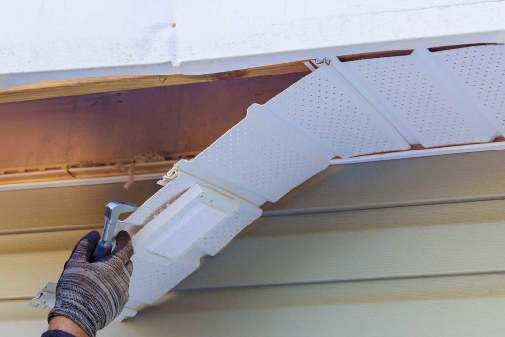 Electric City Gutterman expert repairing gutter damage on a residential roof in Electric City SC.