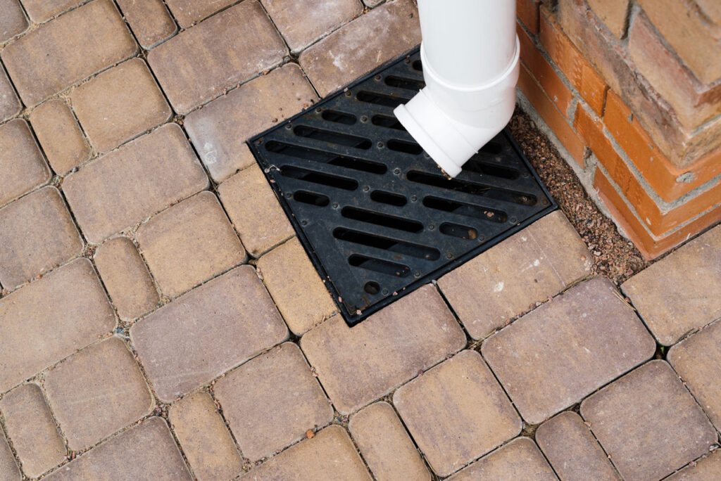 Top 5 Downspout Installation Services in Anderson SC | Electric City Gutterman 2 downspout installation Anderson SC with extension directing water away