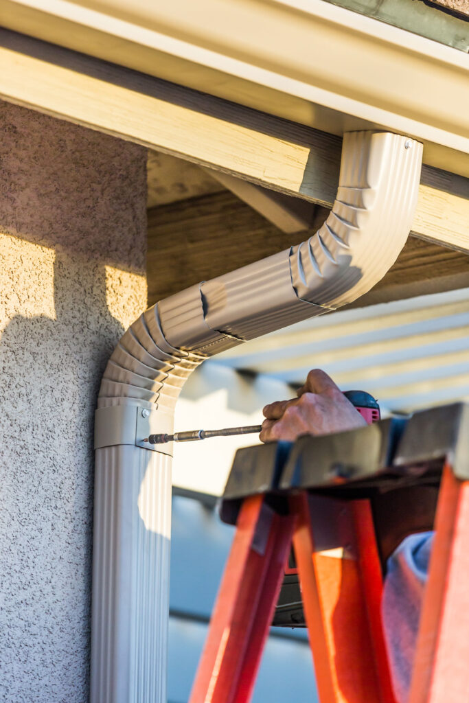Top 5 Downspout Installation Services in Anderson SC | Electric City Gutterman 3 seamless gutters with downspout installation Anderson SC